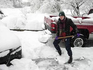 Diana shoveling snow during a blizzard on her 32nd birthday.